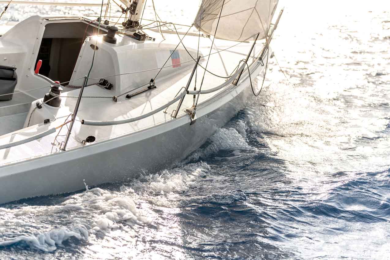 Sunset sailing on a sport yacht during high winds