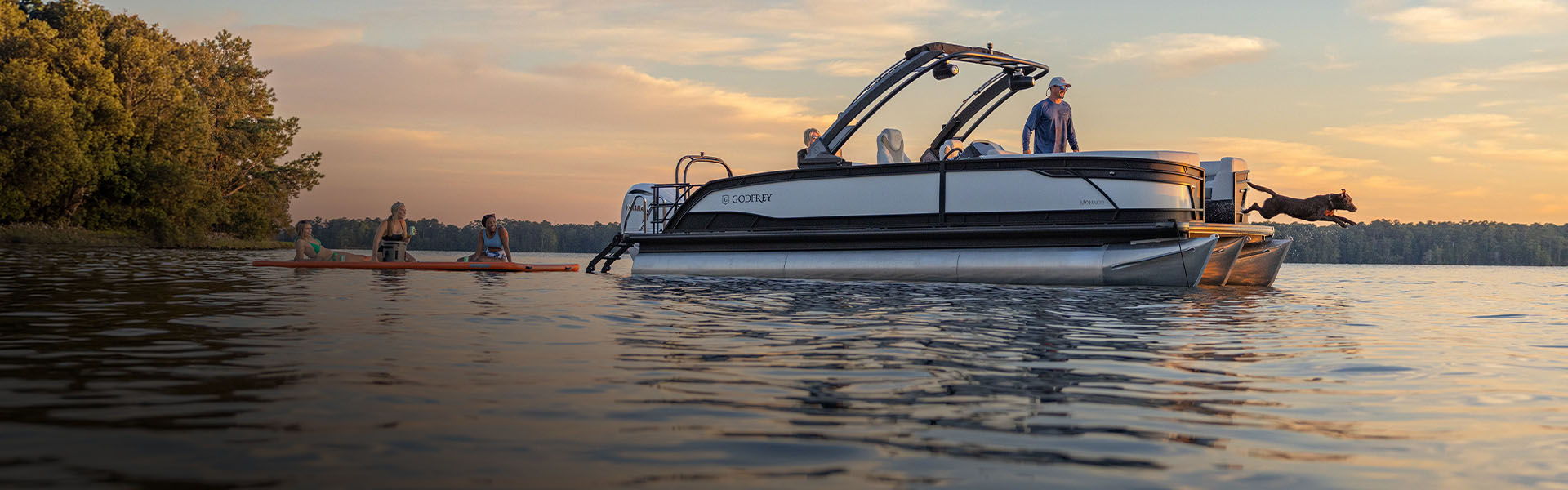 2027 Godfrey Monaco 255 pontoon running at sunset